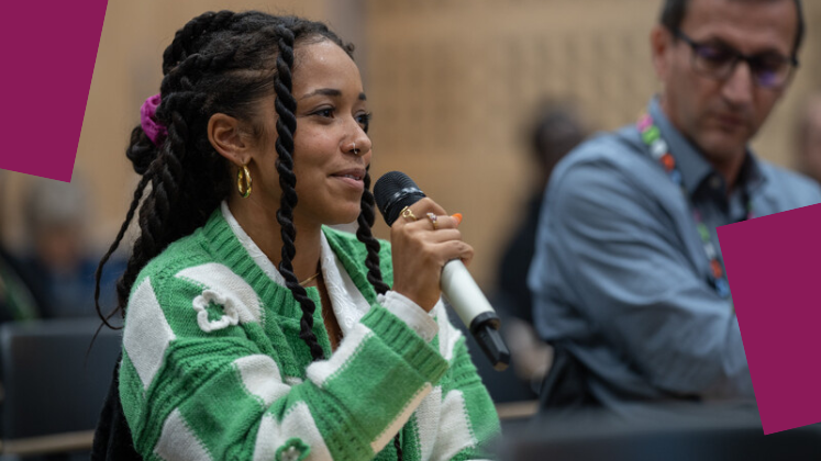 An attendee asking a question using a mic at an event