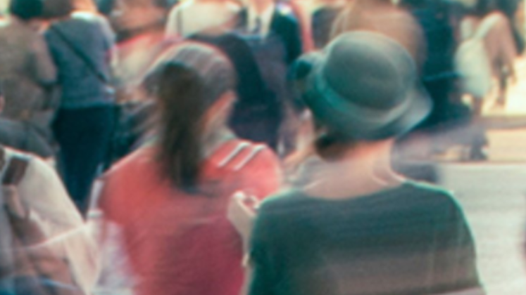 Blurred artistic impression of people walking to work in the city rush