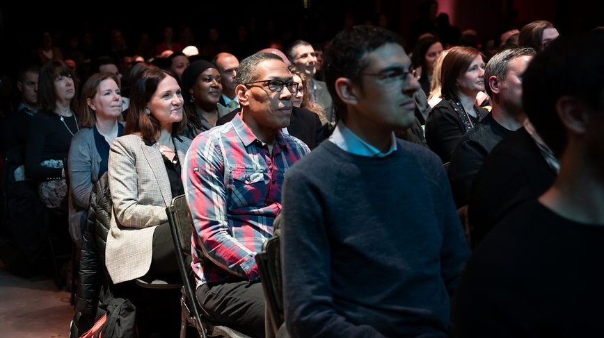 Crowd in a darkened room